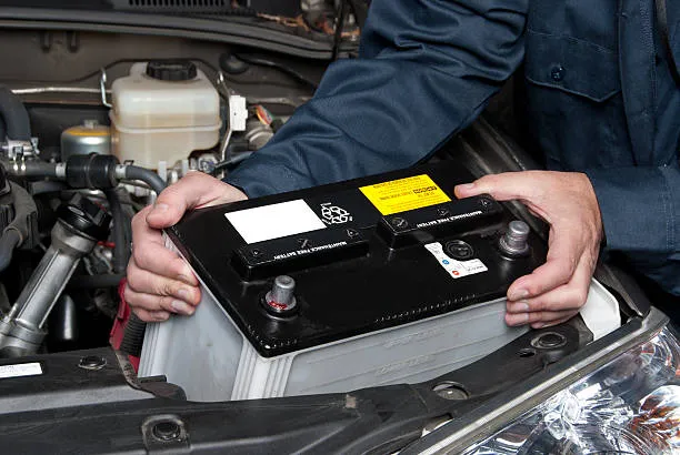 auto-mechanic-replacing-car-batt